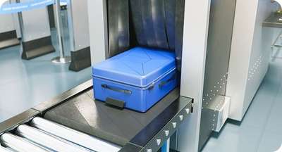 Baggage Encoder Suitcase passing through baggage scanner